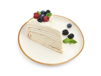 Photo of Piece of tasty crepe cake with berries and mint isolated on white