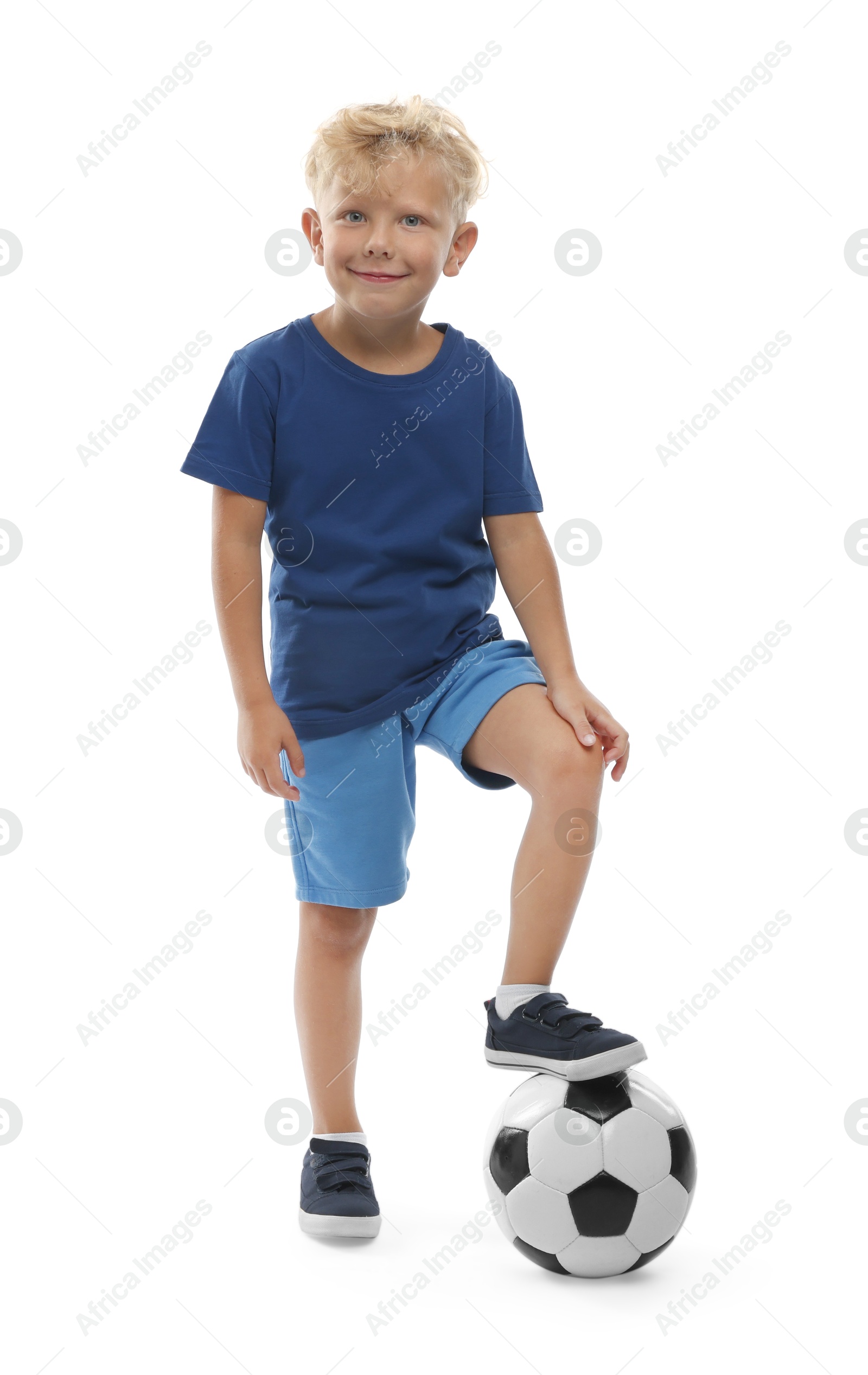 Photo of Choice of profession. Little boy with ball pretending to be football player on white background