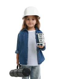 Photo of Choice of profession. Little girl in hardhat with building model and drawing tube pretending to be architect on white background