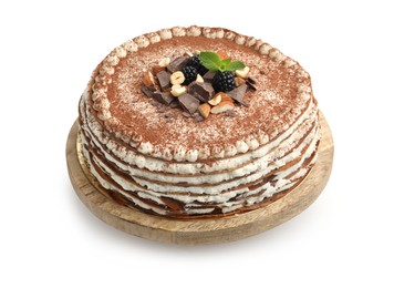 Photo of Delicious crepe cake with chocolate, nuts, blackberries and cocoa powder isolated on white