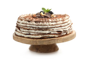Photo of Delicious crepe cake with chocolate, nuts, blackberries and cocoa powder isolated on white