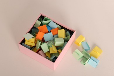 Photo of Color paper pieces in box on light table, above view