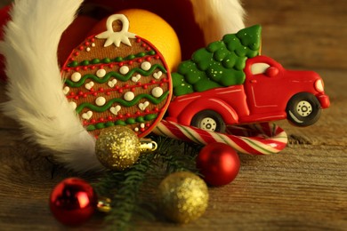 Photo of Saint Nicholas day tradition. Sweets and festive decor on wooden table, closeup