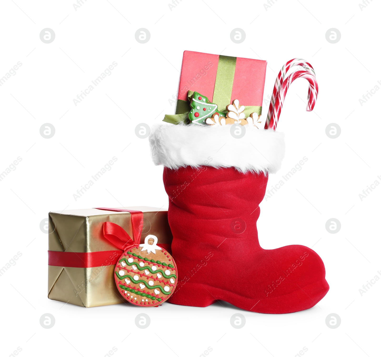 Happy Saint Nicholas day. Red boot with sweets and gift boxes isolated on white Photo of Happy Saint Nicholas day. Red boot with sweets and gift boxes isolated on white