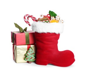 Photo of Happy Saint Nicholas day. Red boot with sweets and gift boxes isolated on white