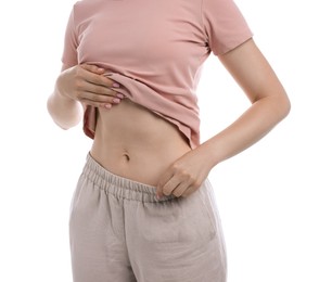 Photo of Woman with flat belly on white background, closeup