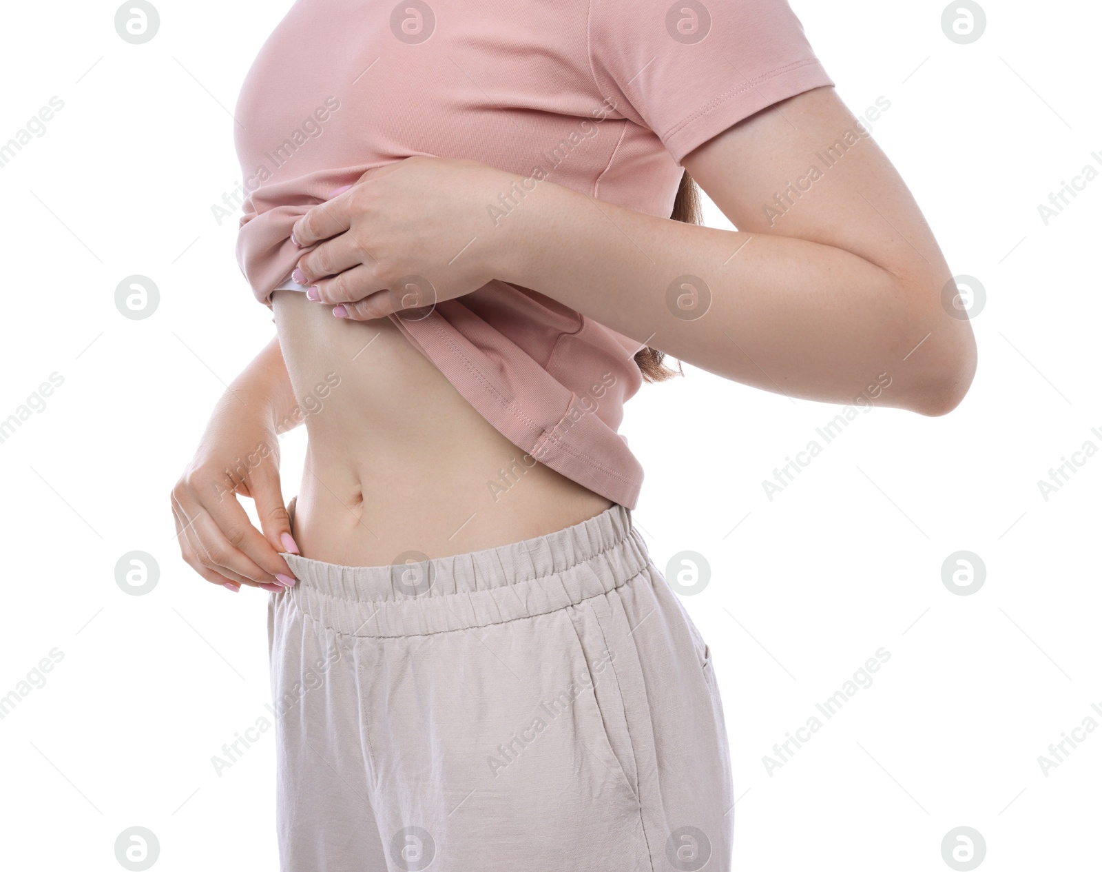 Woman with flat belly on white background, closeup Photo of Woman with flat belly on white background, closeup