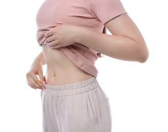 Photo of Woman with flat belly on white background, closeup