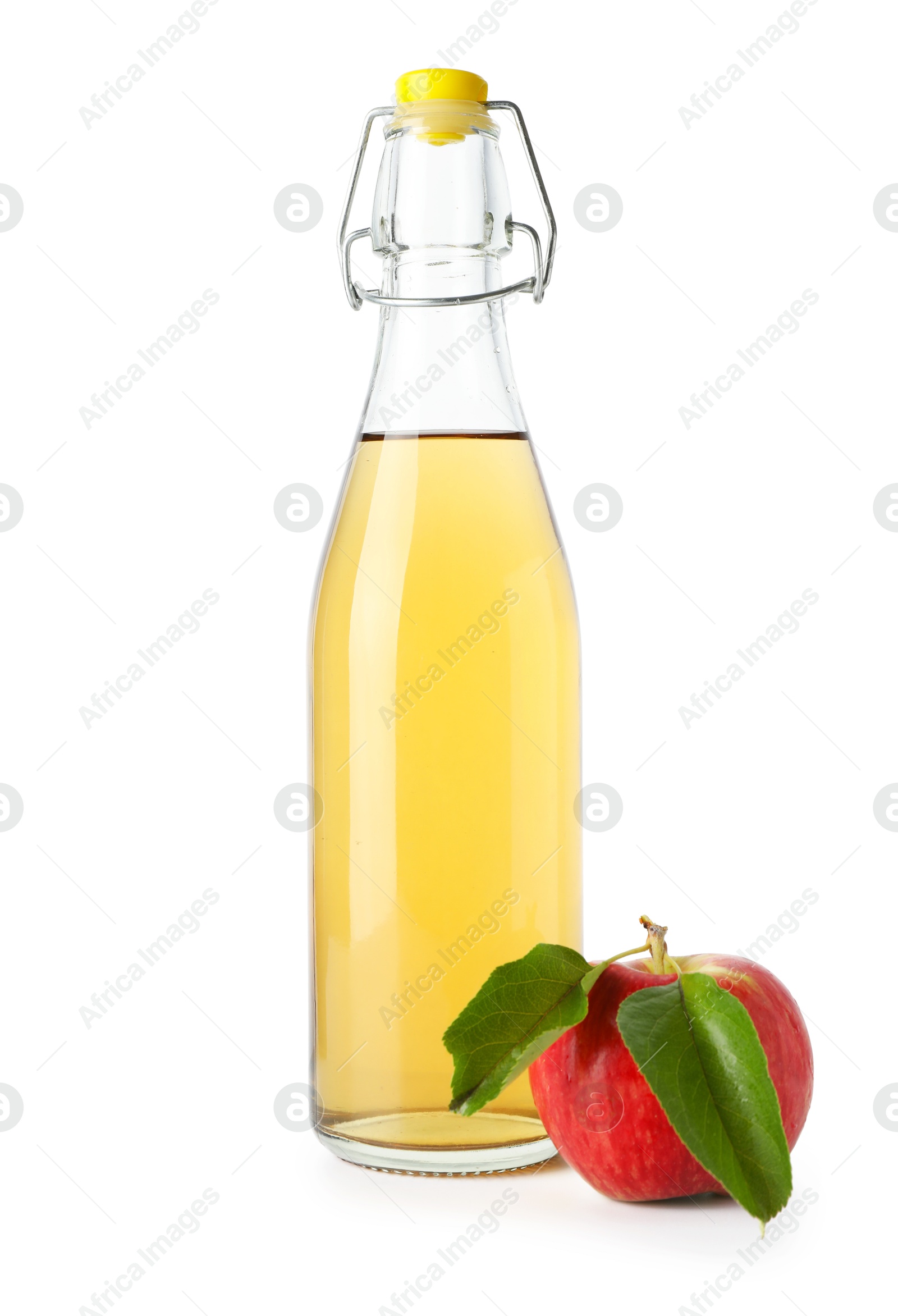 Photo of Delicious cider in glass bottle and apple isolated on white