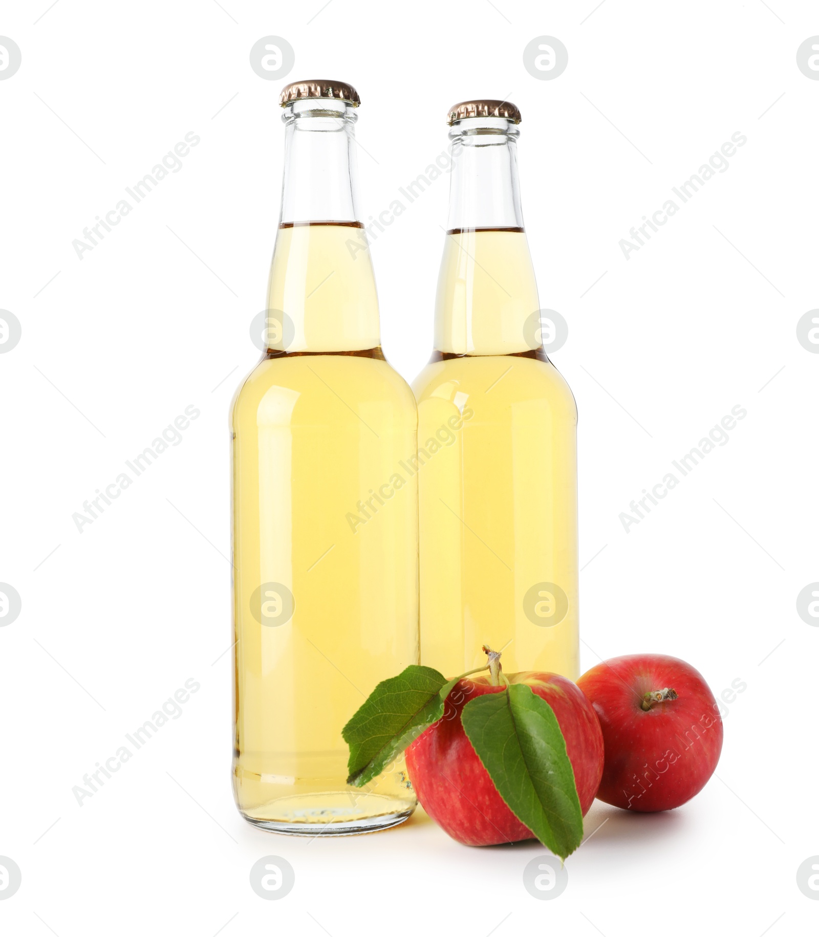 Photo of Delicious cider in glass bottles and apples isolated on white