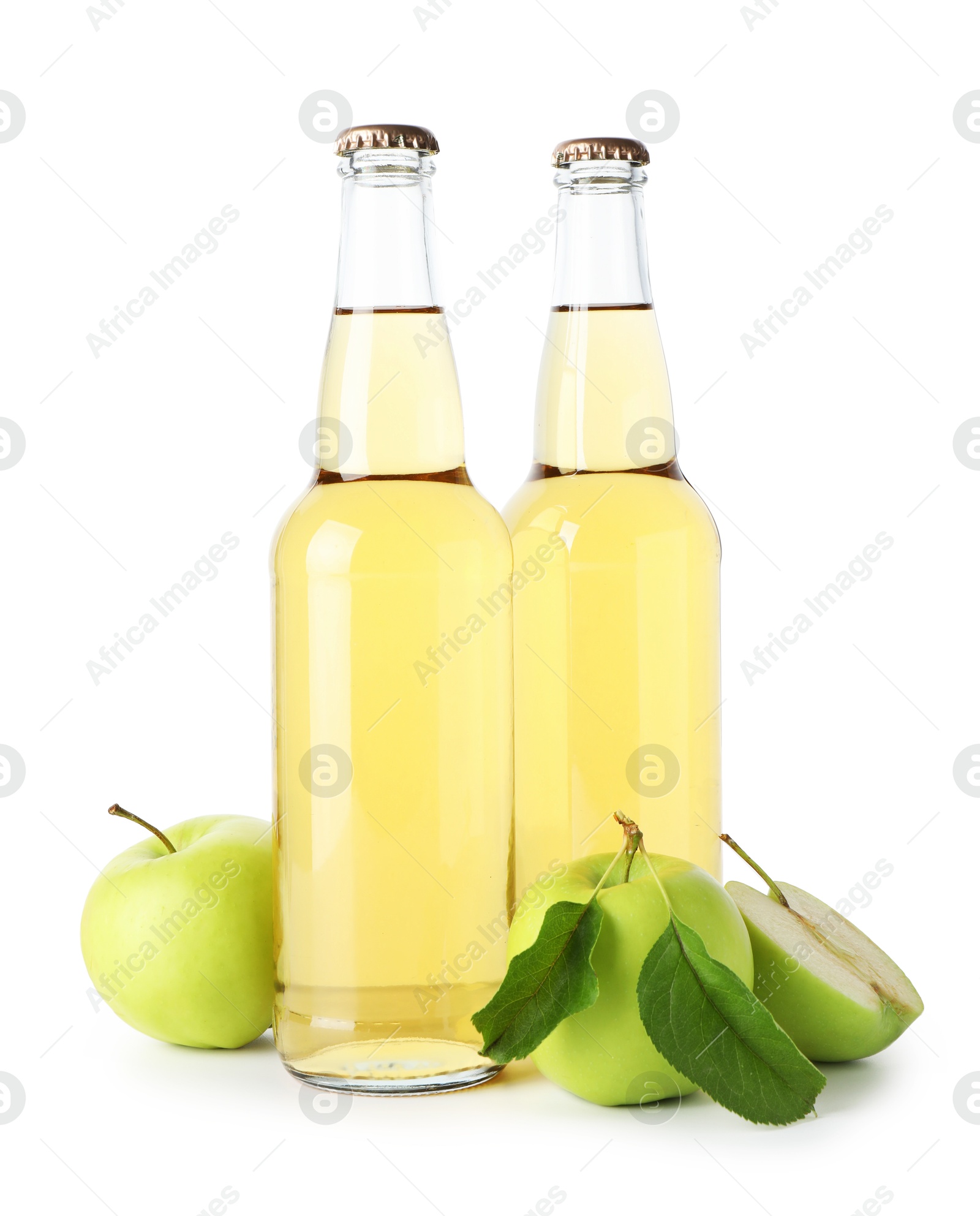 Photo of Delicious cider in glass bottles and apples isolated on white