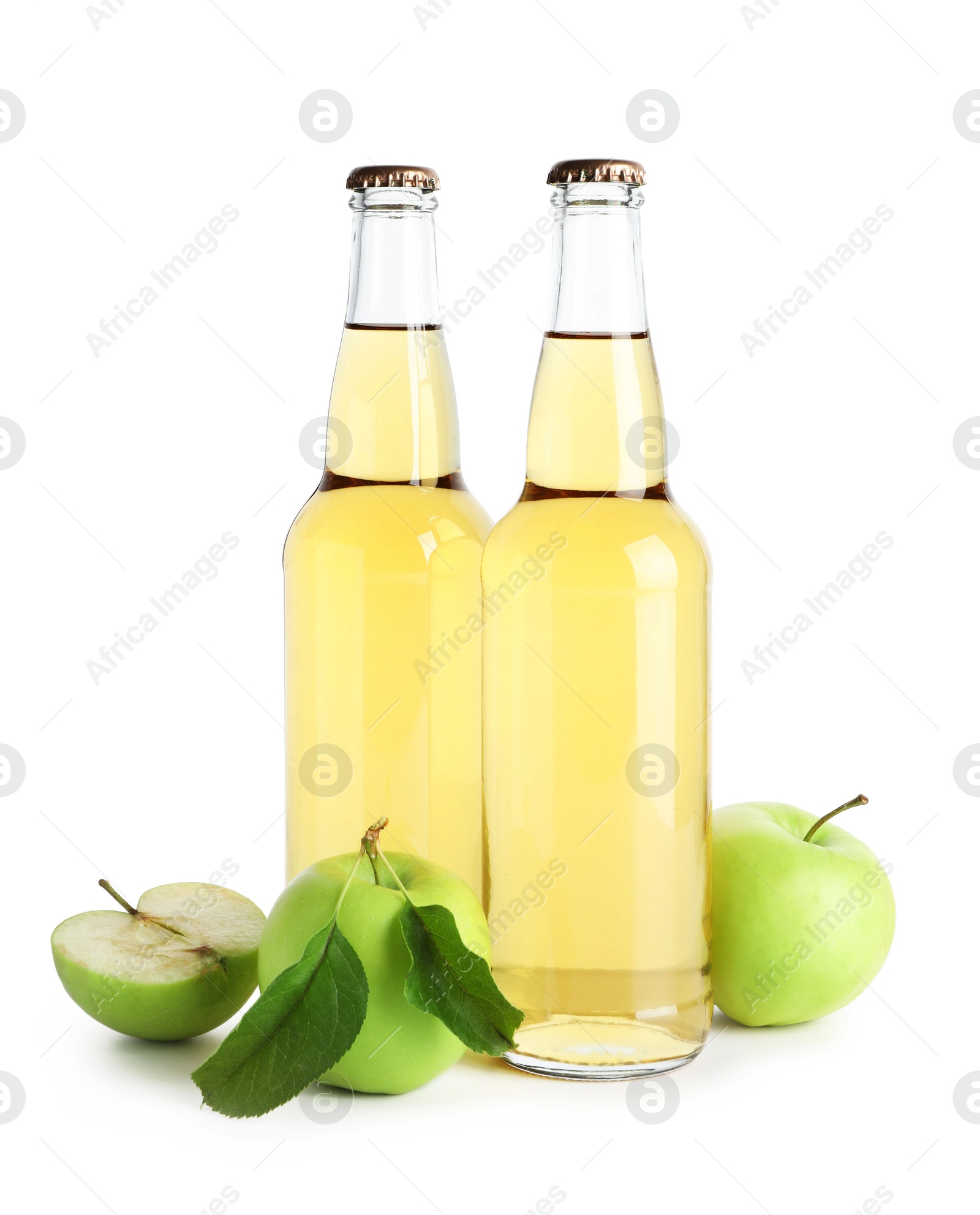 Photo of Delicious cider in glass bottles and apples isolated on white