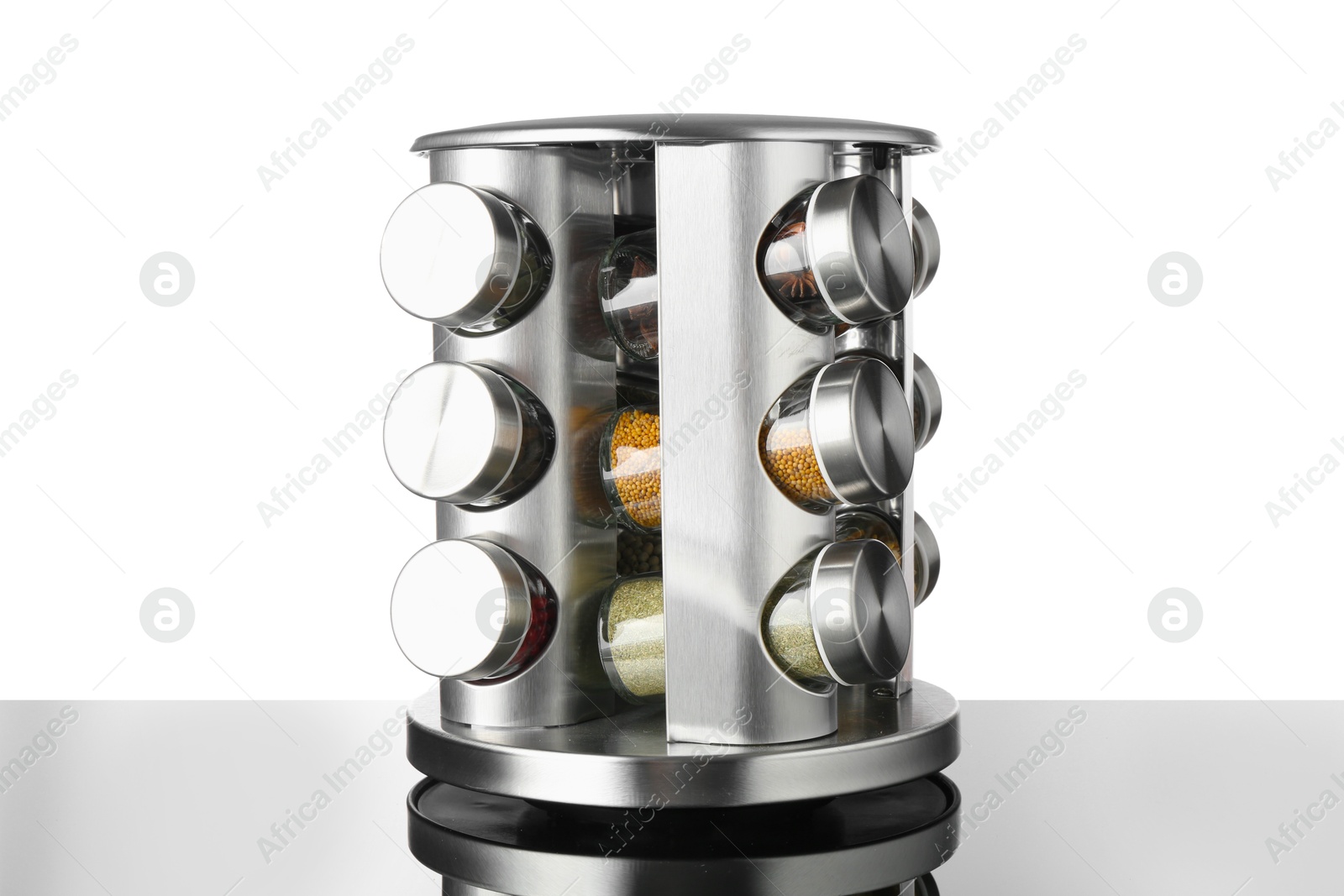 Photo of Set of spices in jars on table against white background