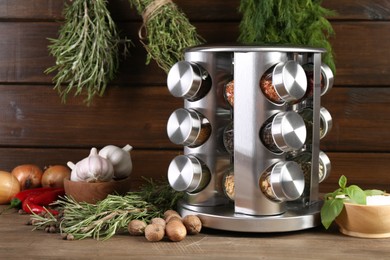 Photo of Different spices and jars on wooden table