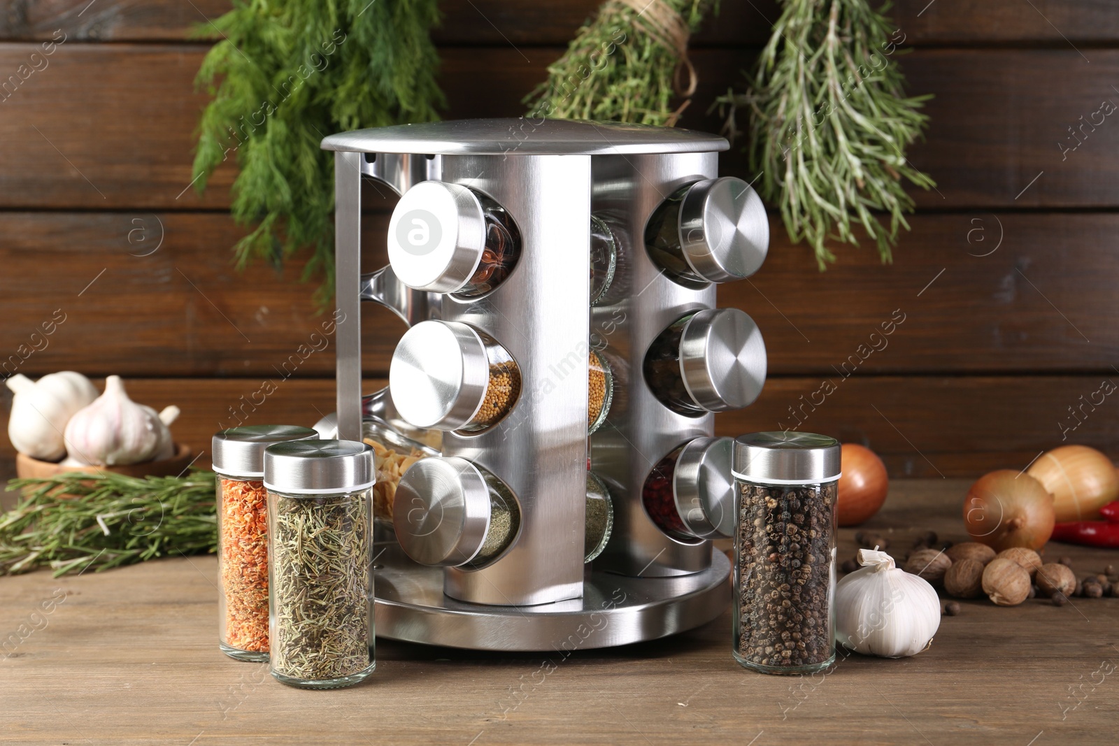 Photo of Different spices and jars on wooden table