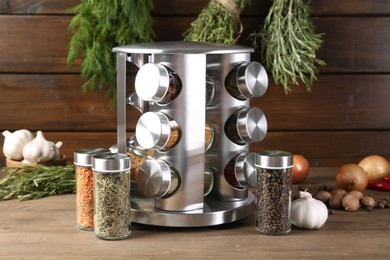 Photo of Different spices and jars on wooden table
