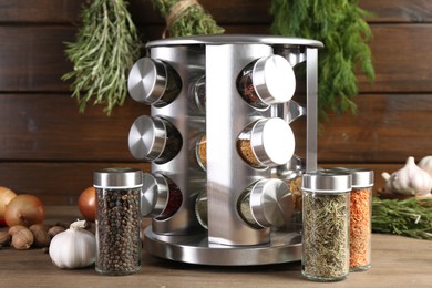 Photo of Different spices and jars on wooden table