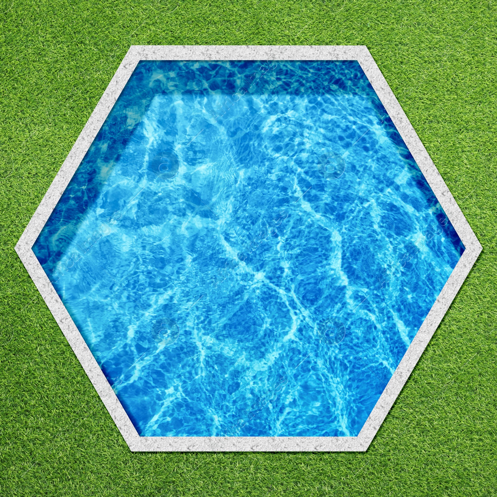 Image of Hexagonal swimming pool surrounded by green grass, top view