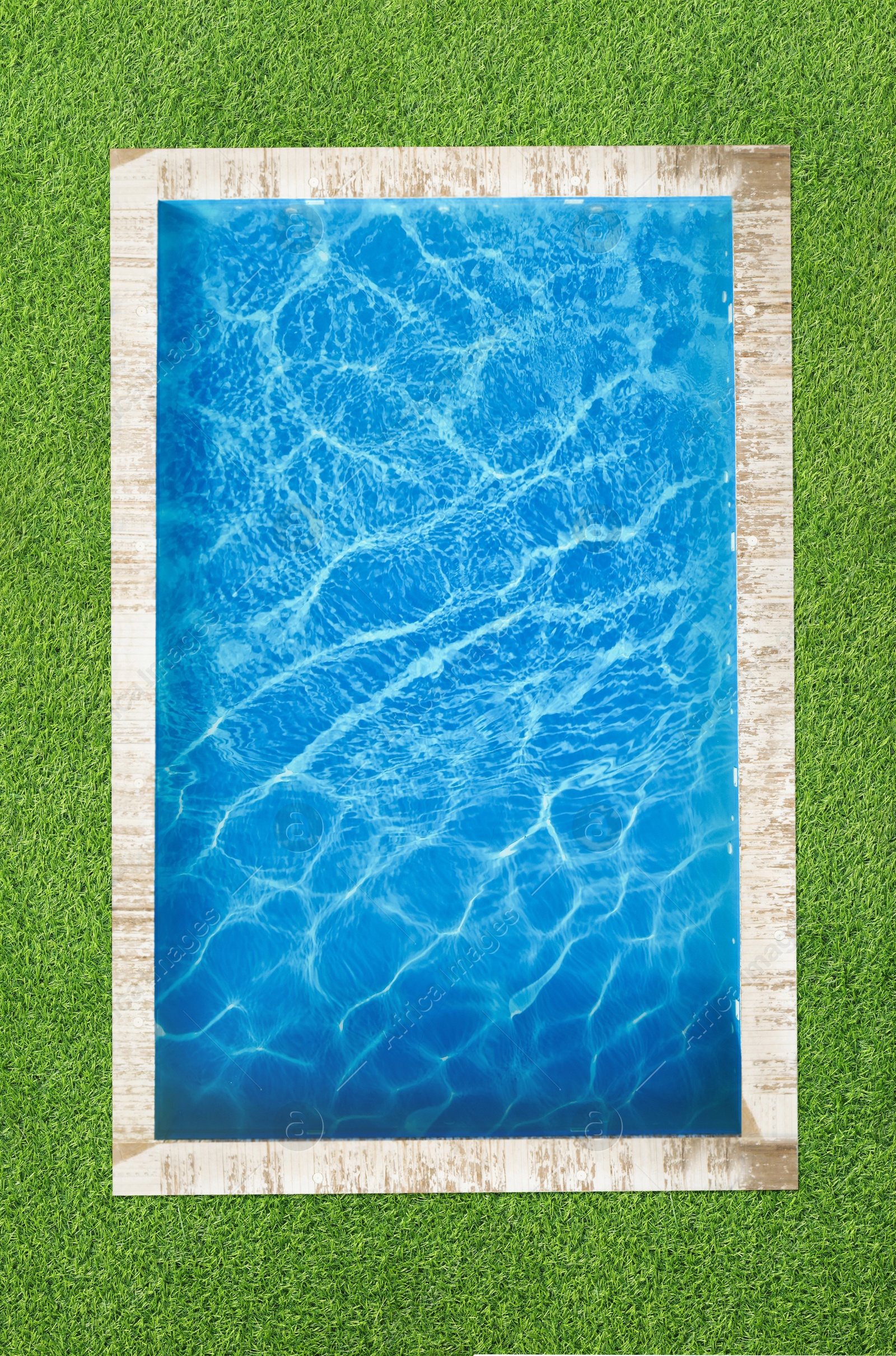 Swimming pool surrounded by green grass, top view Image of Swimming pool surrounded by green grass, top view