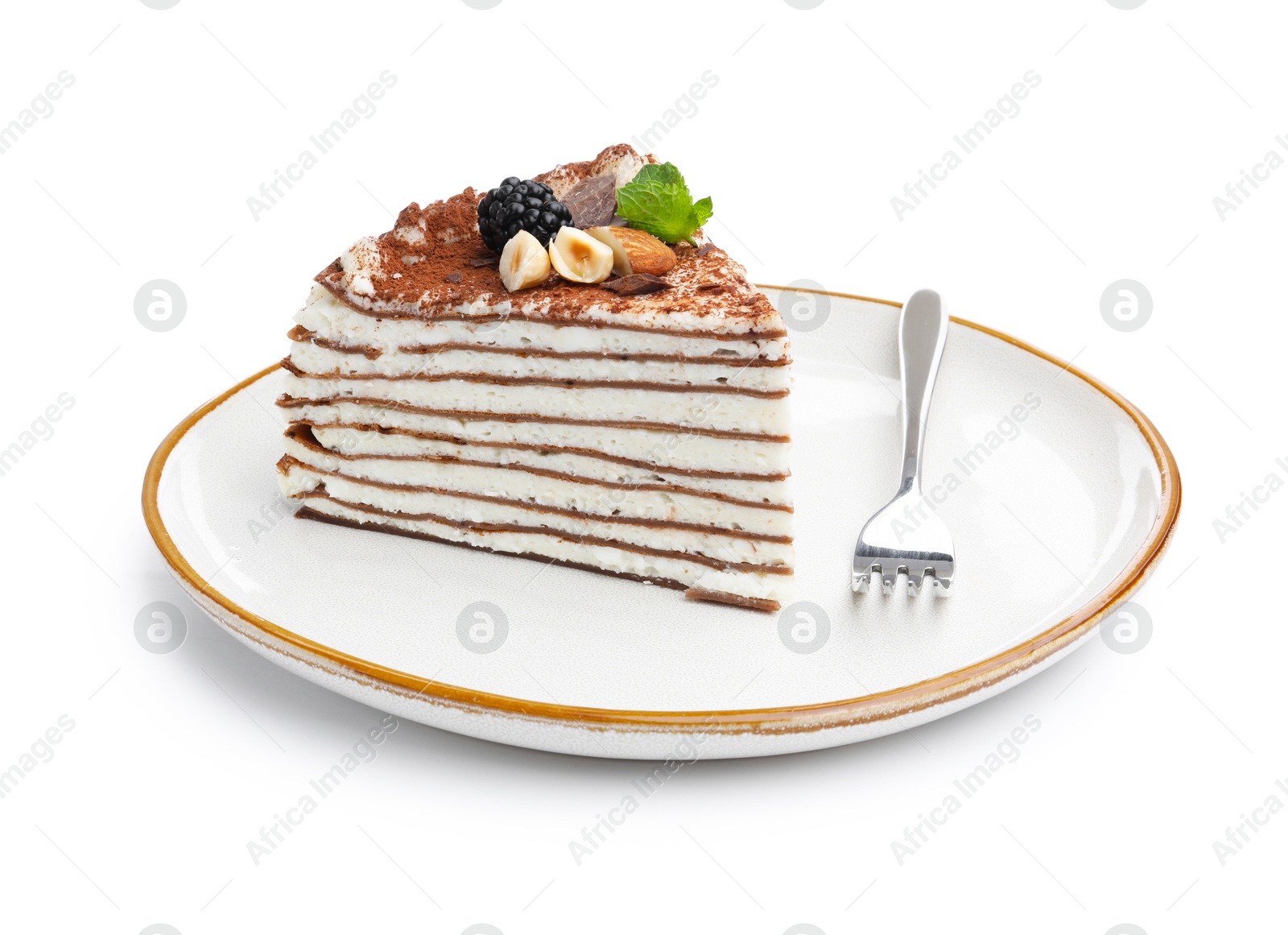 Photo of Piece of tasty crepe cake with cocoa powder, chocolate, nuts and blackberry isolated on white