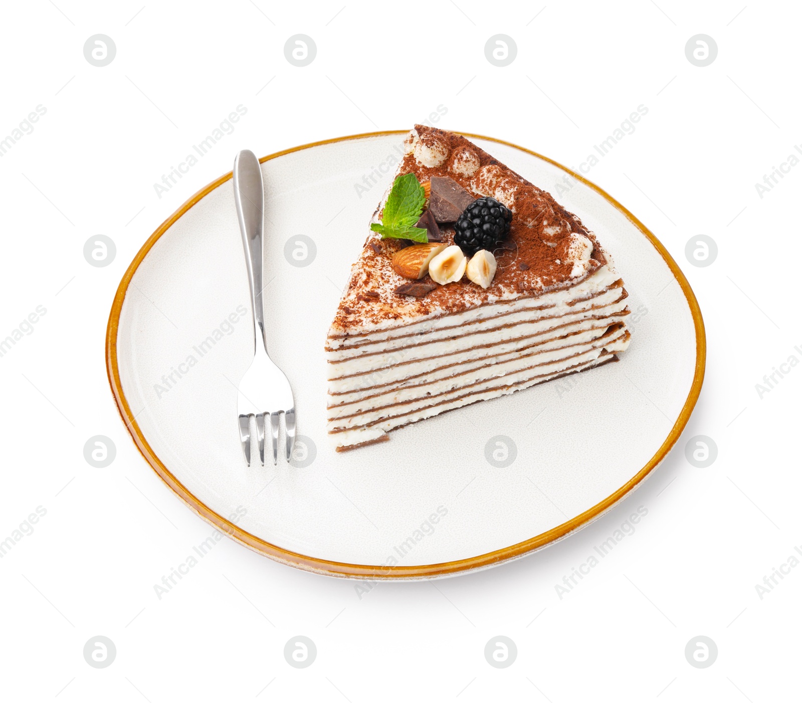Photo of Piece of tasty crepe cake with cocoa powder, chocolate, nuts and blackberry isolated on white