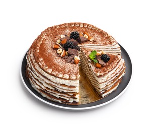 Photo of Tasty crepe cake with cocoa powder, chocolate, nuts, blackberries and mint isolated on white