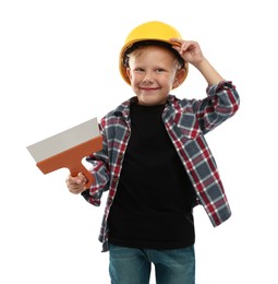 Photo of Choice of profession. Little boy with spatula pretending to be builder on white background