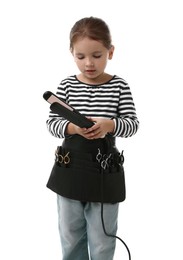 Photo of Choice of profession. Cute little girl with straightener and tools pretending to be hairdresser on white background