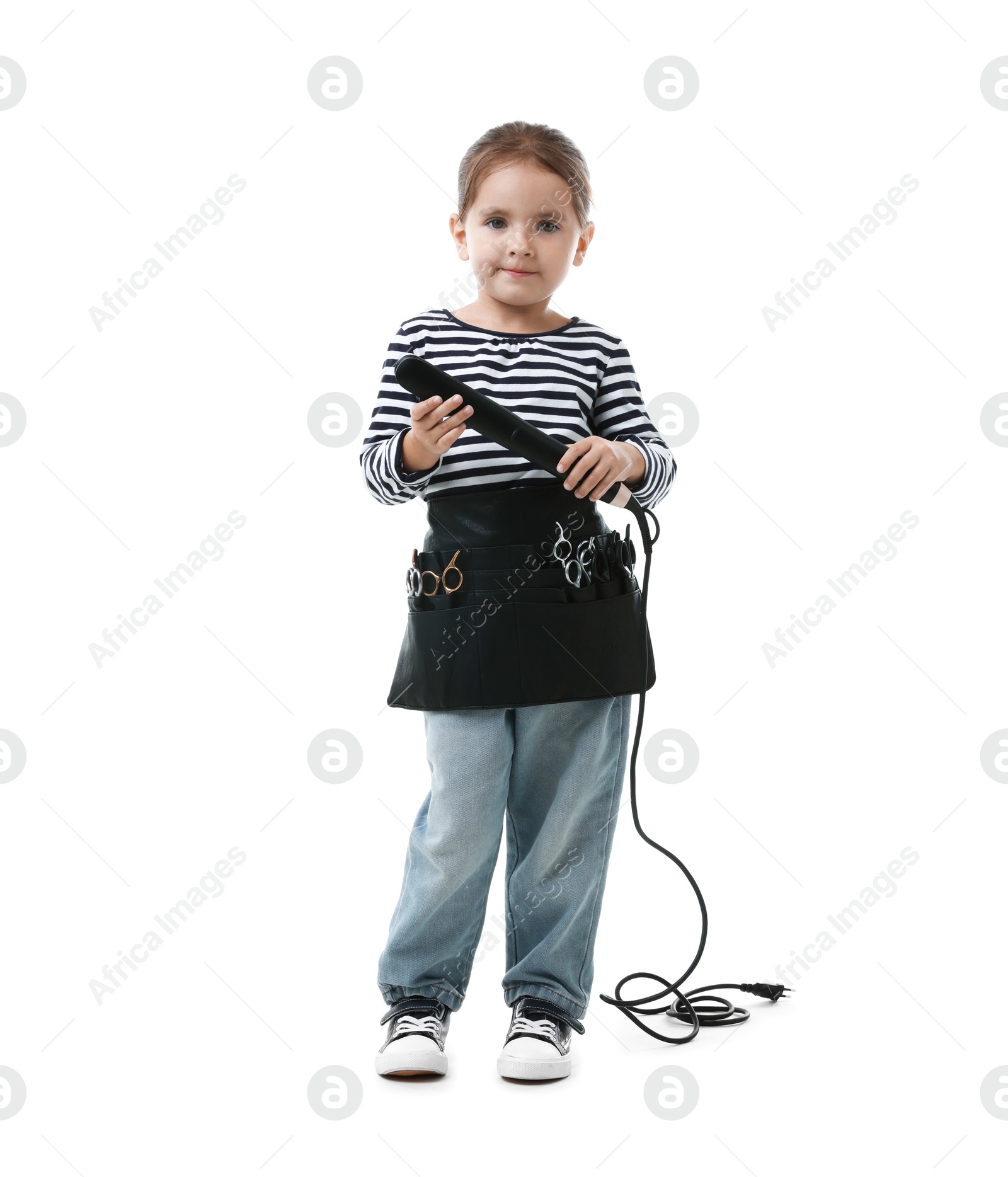 Choice of profession. Cute little girl with straightener and tools pretending to be hairdresser on white background Photo of Choice of profession. Cute little girl with straightener and tools pretending to be hairdresser on white background