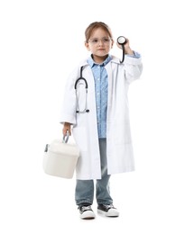 Photo of Choice of profession. Little girl in uniform with stethoscope and case pretending to be doctor on white background