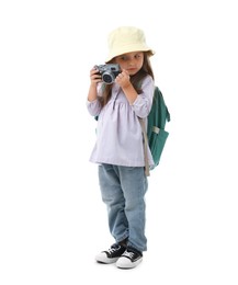 Photo of Choice of profession. Little girl with camera pretending to be photographer on white background