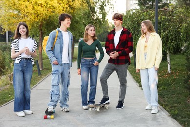 Photo of Group of teenagers walking on city street