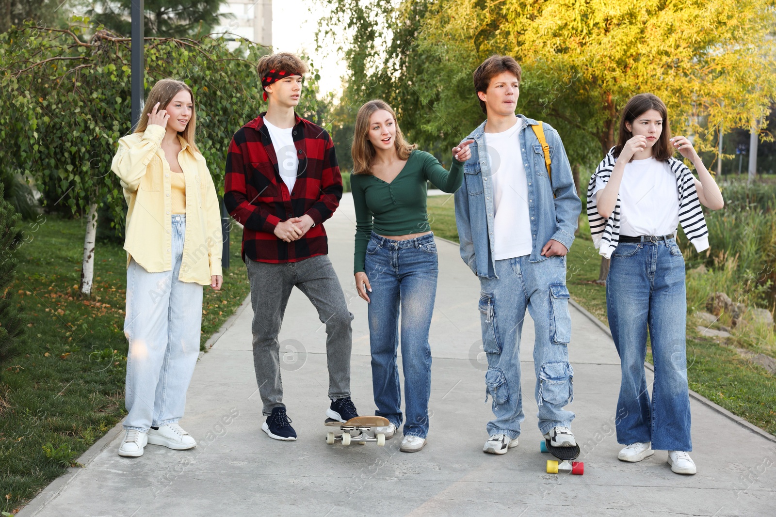 Photo of Group of teenagers walking on city street