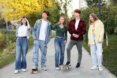 Photo of Group of teenagers walking on city street