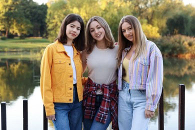 Photo of Portrait of teenage girls near lake outdoors