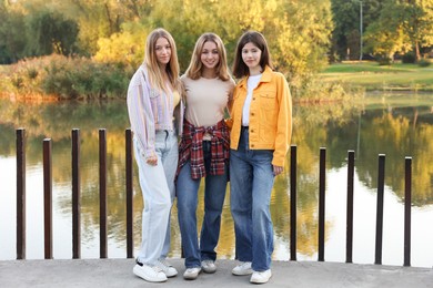 Photo of Portrait of teenage girls near lake outdoors