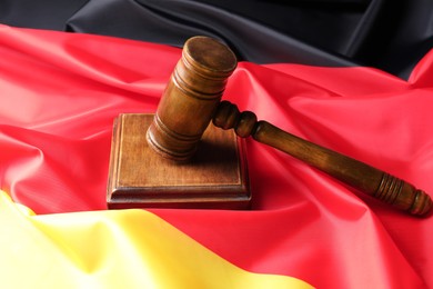 Photo of Wooden judge's gavel on flag of Germany
