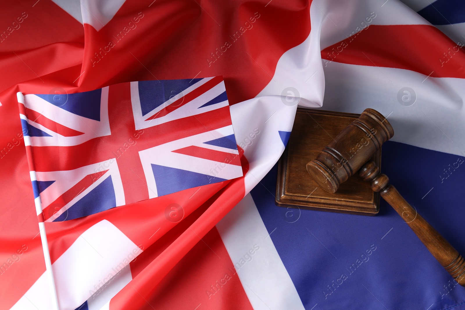 Photo of Judge's gavel on flags of United Kingdom, top view