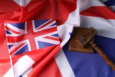 Photo of Judge's gavel on flags of United Kingdom, top view