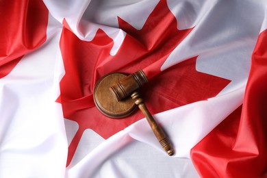 Photo of Judge's gavel on flag of Canada, top view