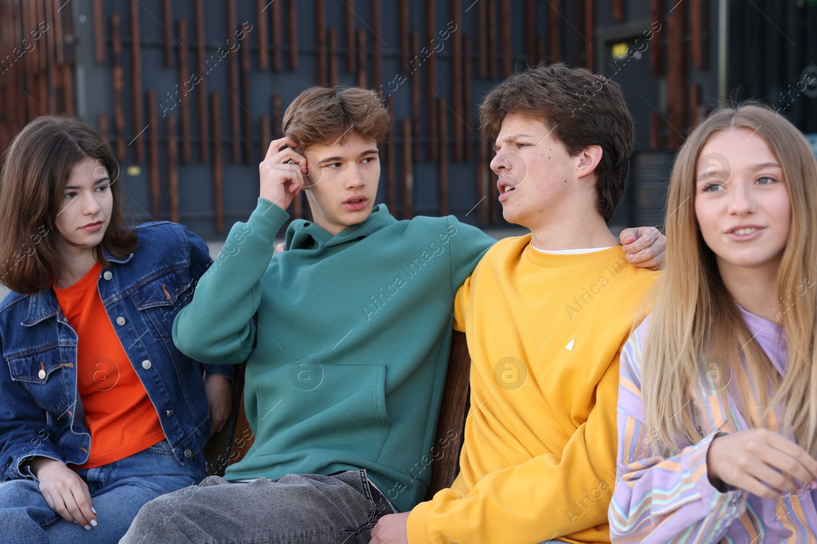Photo of Group of teenagers spending time together outdoors