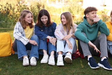 Photo of Group of teenagers spending time together in park
