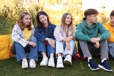 Photo of Group of teenagers spending time together in park
