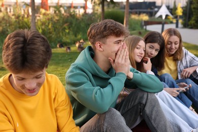 Photo of Group of teenagers spending time together in park