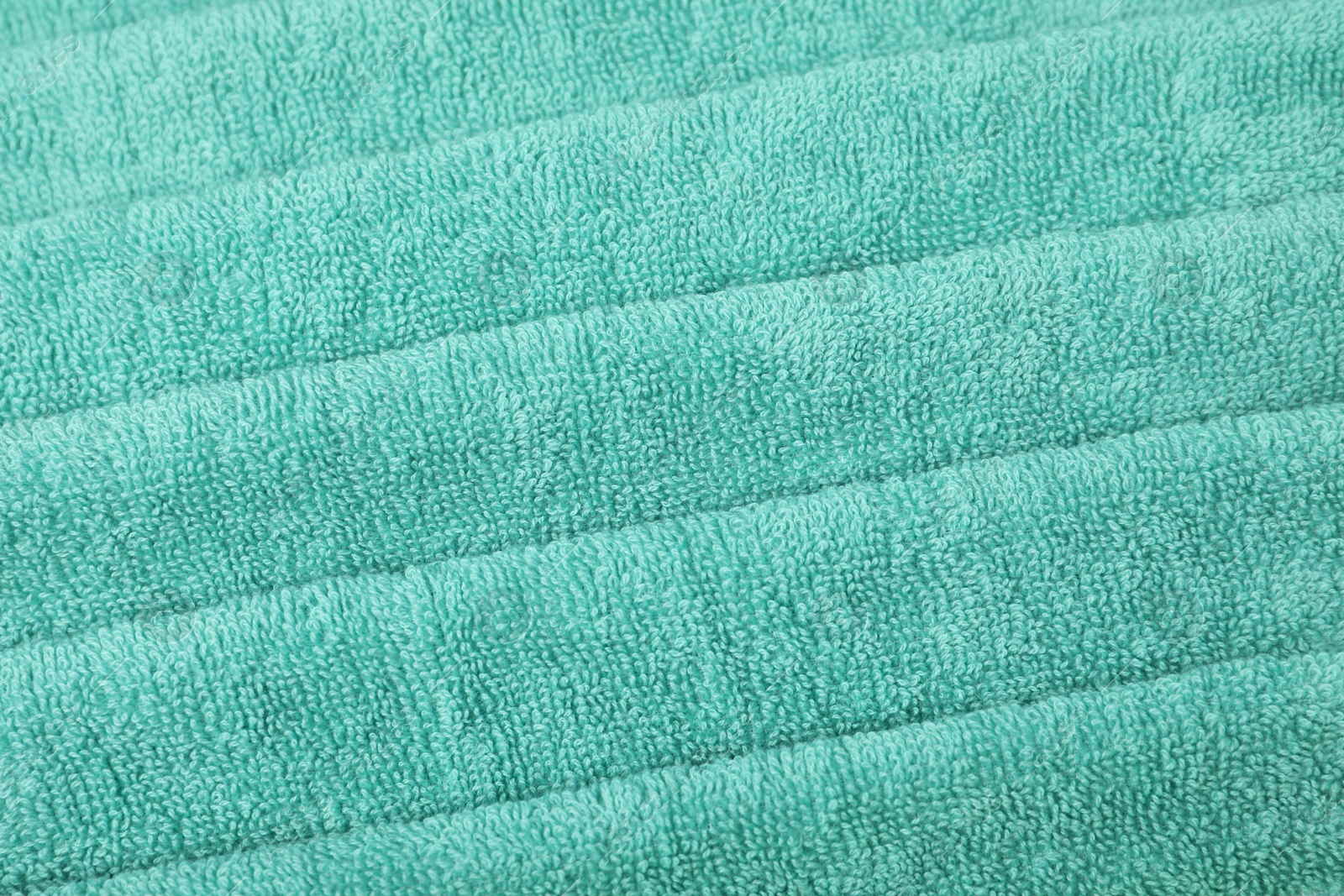 Photo of Turquoise terry towel as background, above view