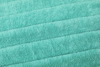 Photo of Turquoise terry towel as background, above view