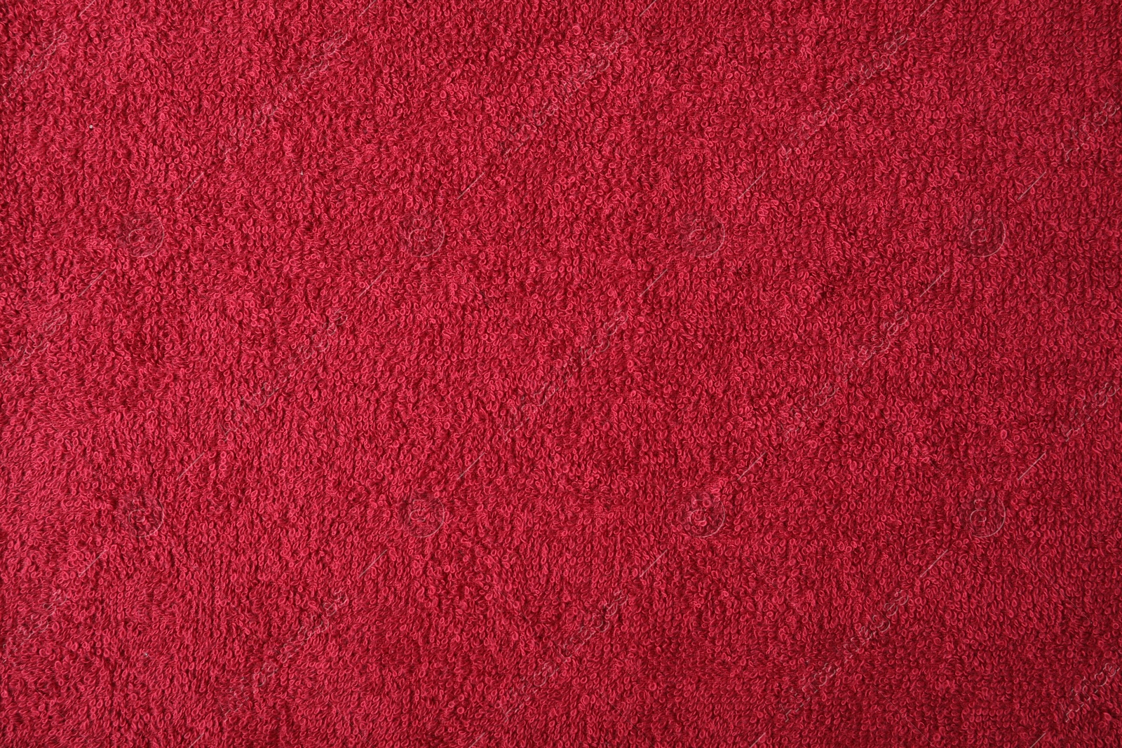 Photo of Red terry towel as background, top view