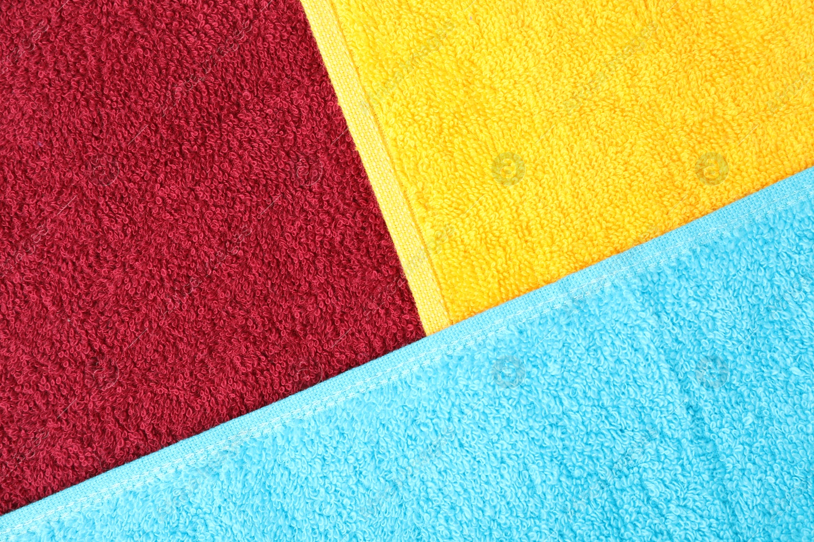 Photo of Bright terry towels as background, top view