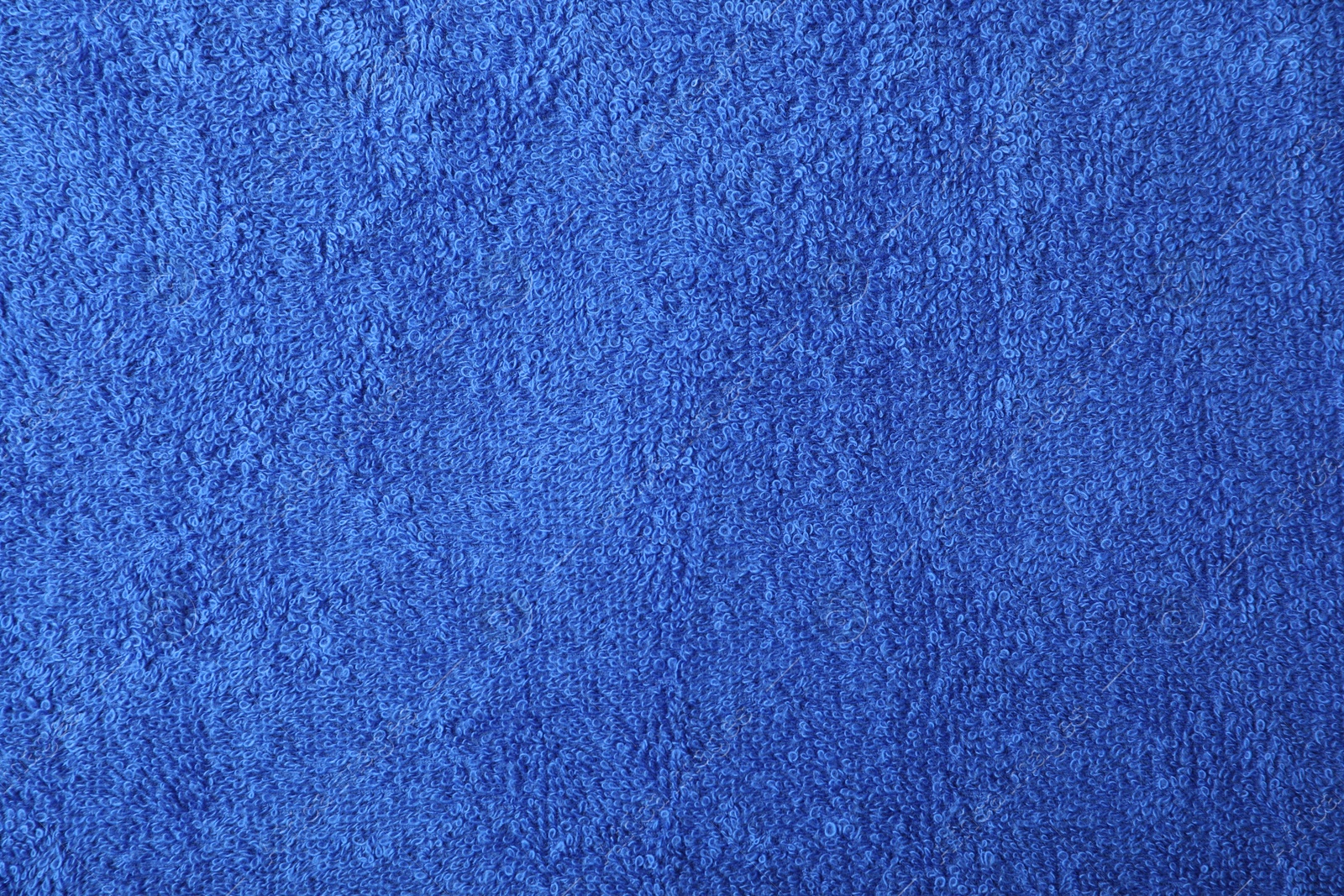 Photo of Blue terry towel as background, top view