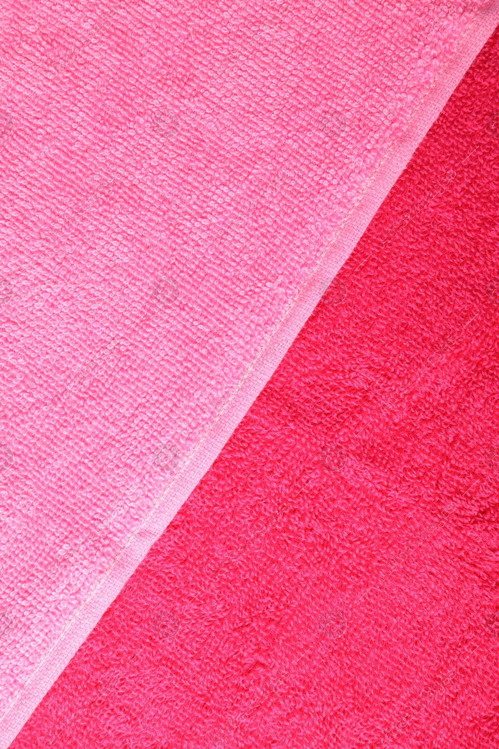 Photo of Bright terry towels as background, top view